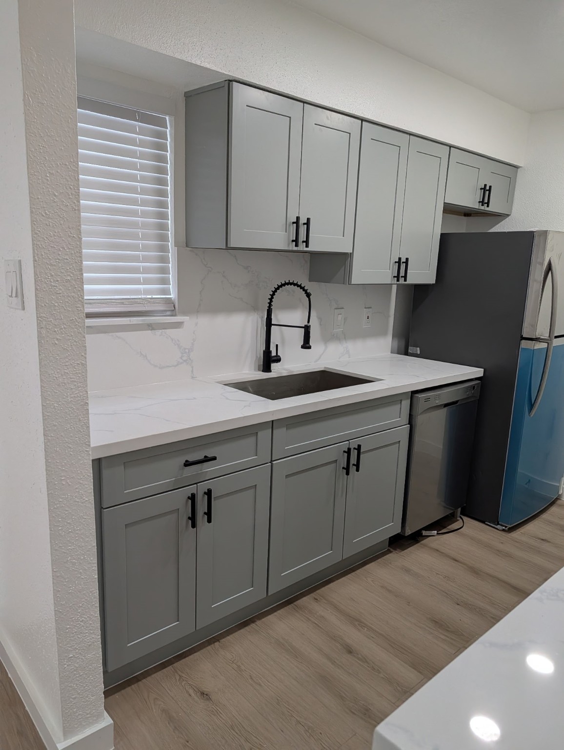 6001 Reims Road, Unit 1412 Houston, TX 77036 - Photo 27 of 28 a kitchen with a sink and cabinets
