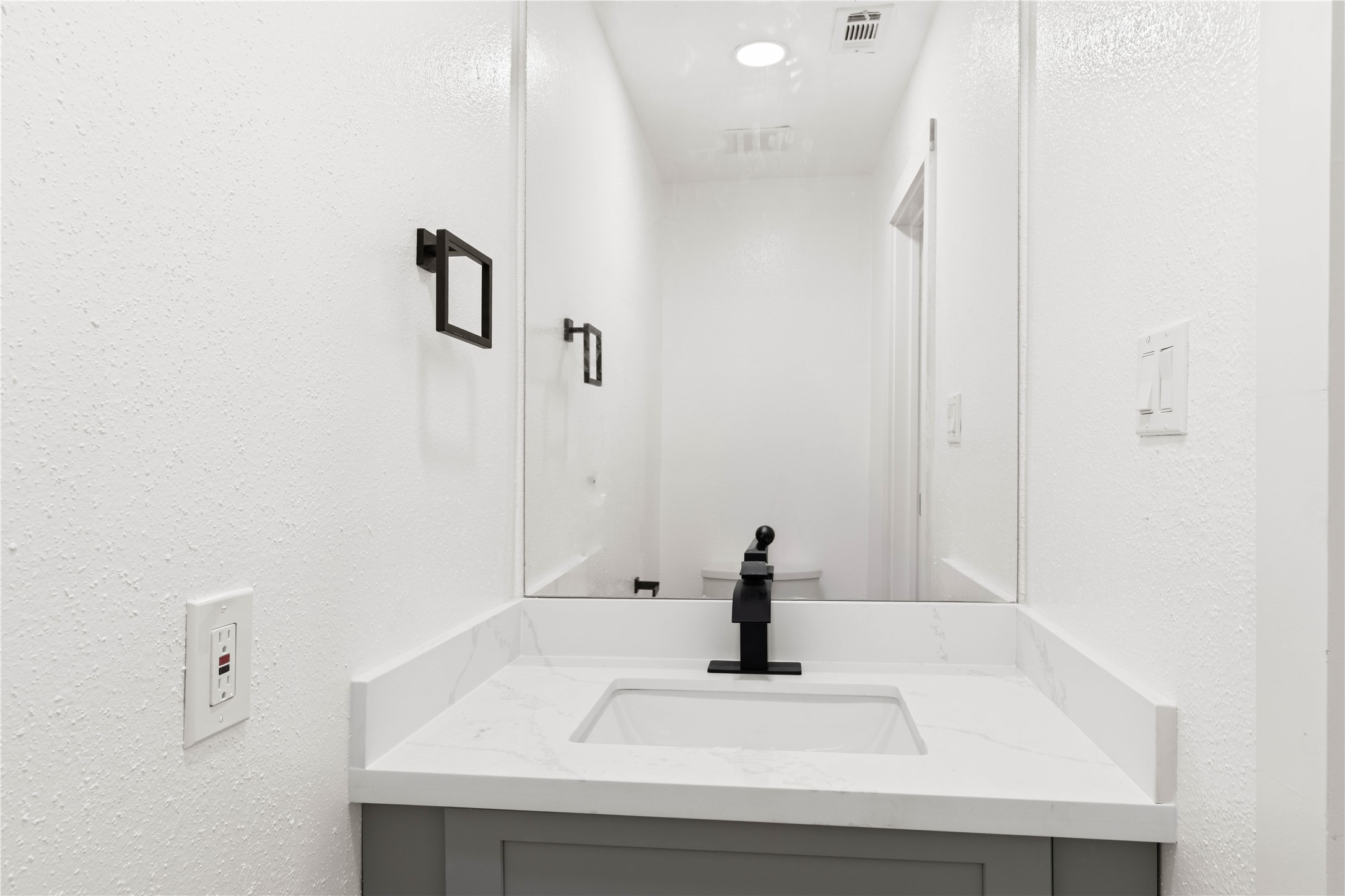 6001 Reims Road, Unit 1412 Houston, TX 77036 - Photo 6 of 28 a close view of sink and mirror