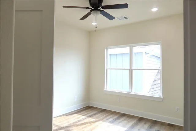 a view of an empty room and window