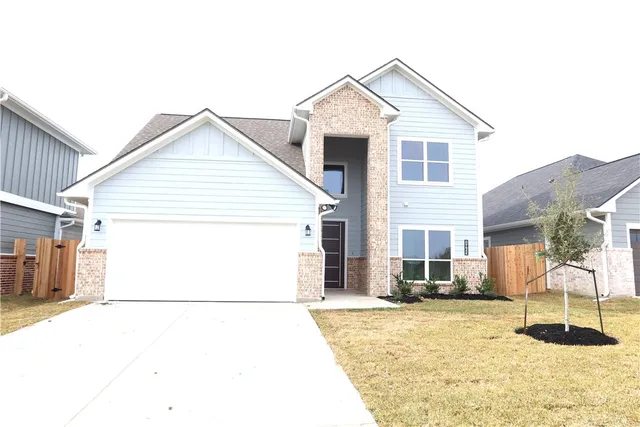 a view of a white house with a outdoor space