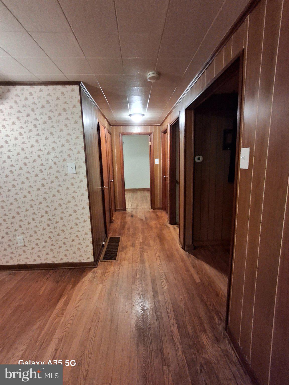 139 Cessna Hill Road Boswell, PA 15531 - Photo 22 of 34 Inviting hallway with warm wood tones.