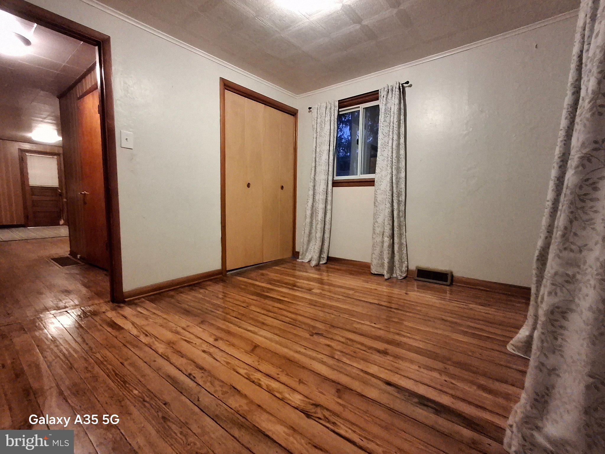 139 Cessna Hill Road Boswell, PA 15531 - Photo 25 of 34 Spacious room with warm wooden floors.