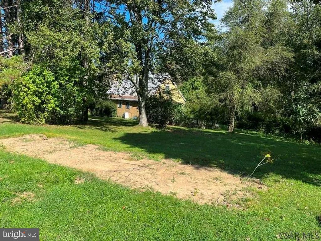 139 Cessna Hill Road Boswell, PA 15531 - Photo 3 of 34 Serene green space with rustic charm.