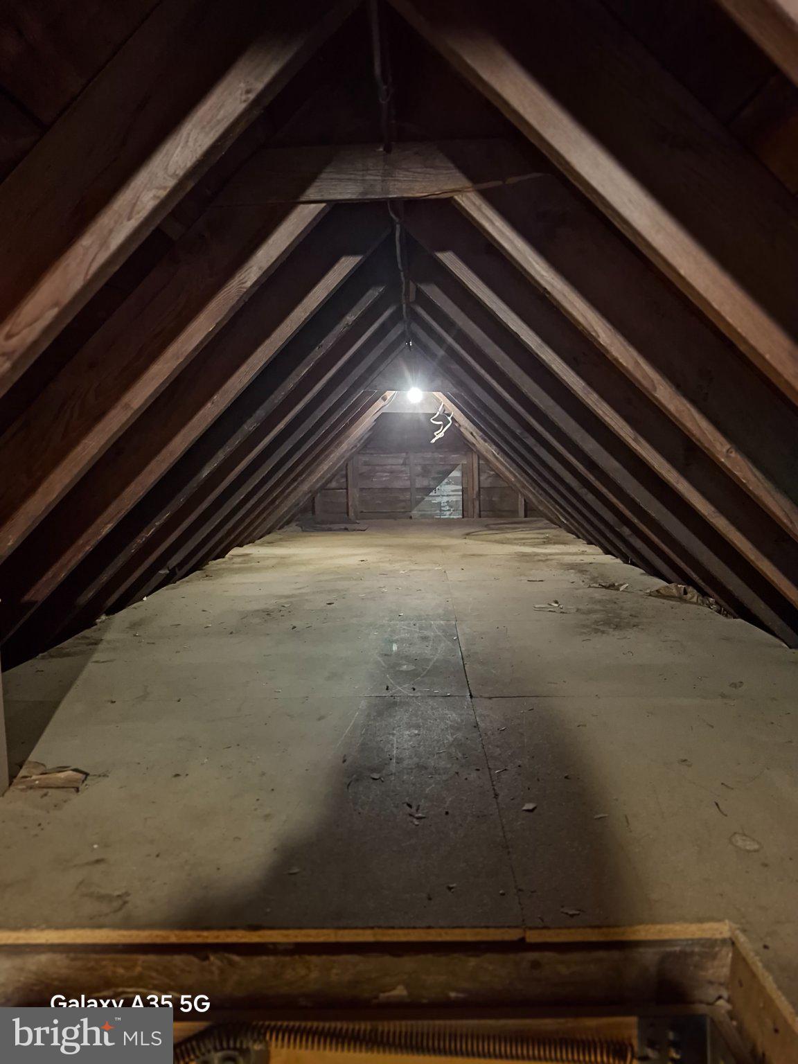 139 Cessna Hill Road Boswell, PA 15531 - Photo 33 of 34 Spacious attic with rustic beams.