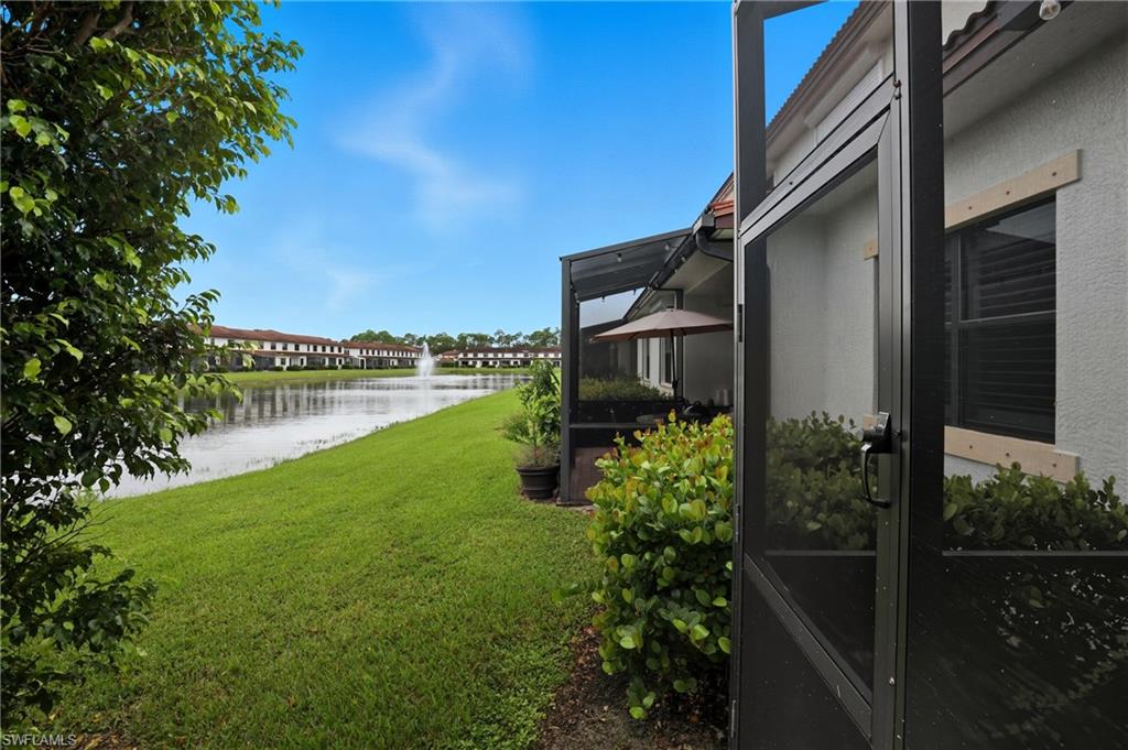 7894 Bristol Circle Naples, FL 34120 - Photo 12 of 29 a backyard of a house with lots of green space and lake view