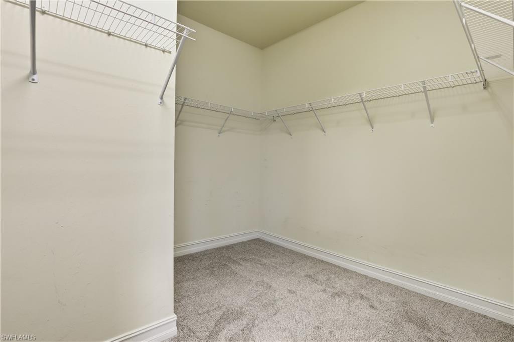 7894 Bristol Circle Naples, FL 34120 - Photo 15 of 29 a view of a room with racks on the wall