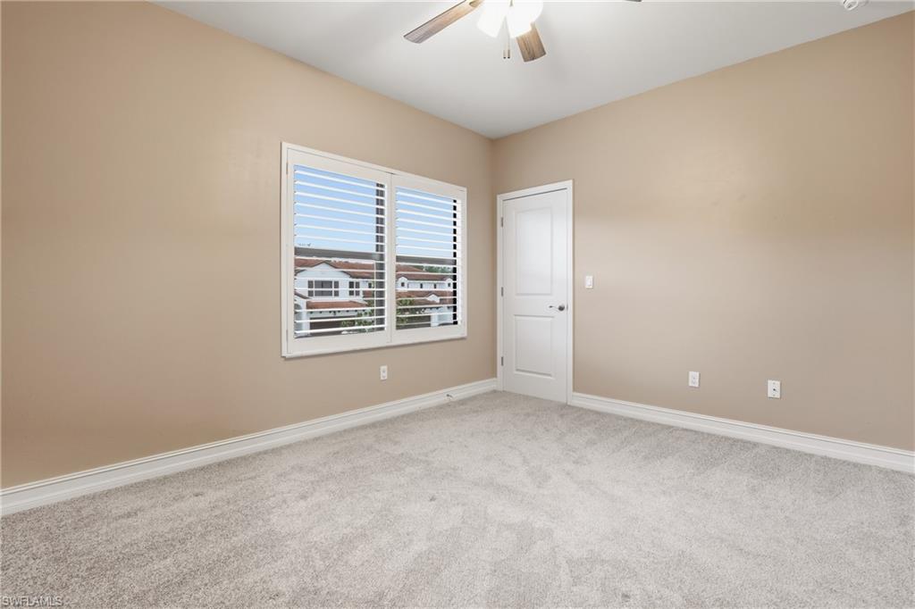 7894 Bristol Circle Naples, FL 34120 - Photo 17 of 29 an empty room with a window