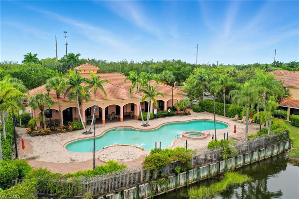 7894 Bristol Circle Naples, FL 34120 - Photo 26 of 29 a view of a house with swimming pool yard and patio