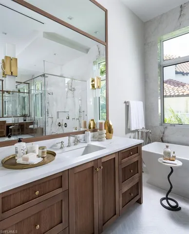 a bathroom with a sink double vanity and a mirror