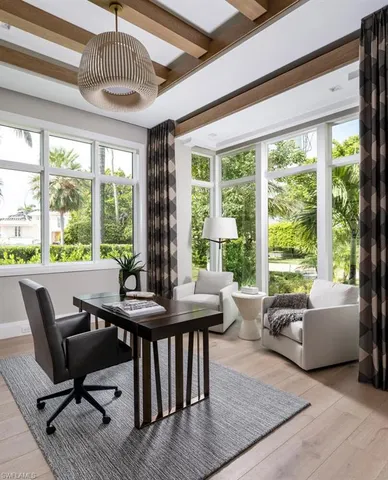 a view of a dining room with furniture window and outside view
