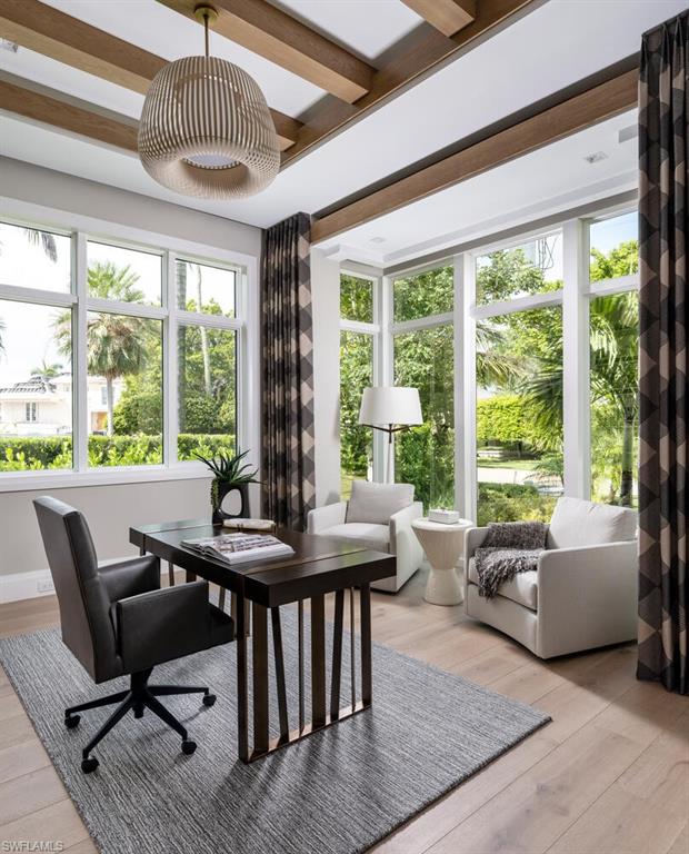 3131 Gin Lane Naples, FL 34102 - Photo 13 of 33 a view of a dining room with furniture window and outside view