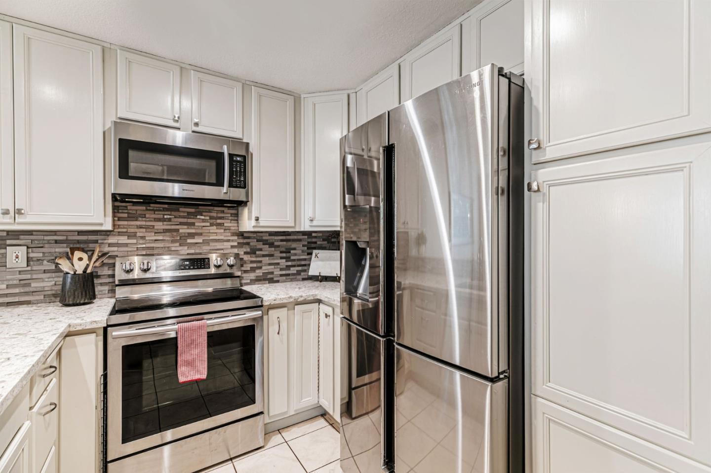 3400 La Terrace Circle San Jose, CA 95123 - Photo 11 of 39 a kitchen with stainless steel appliances a refrigerator sink and microwave