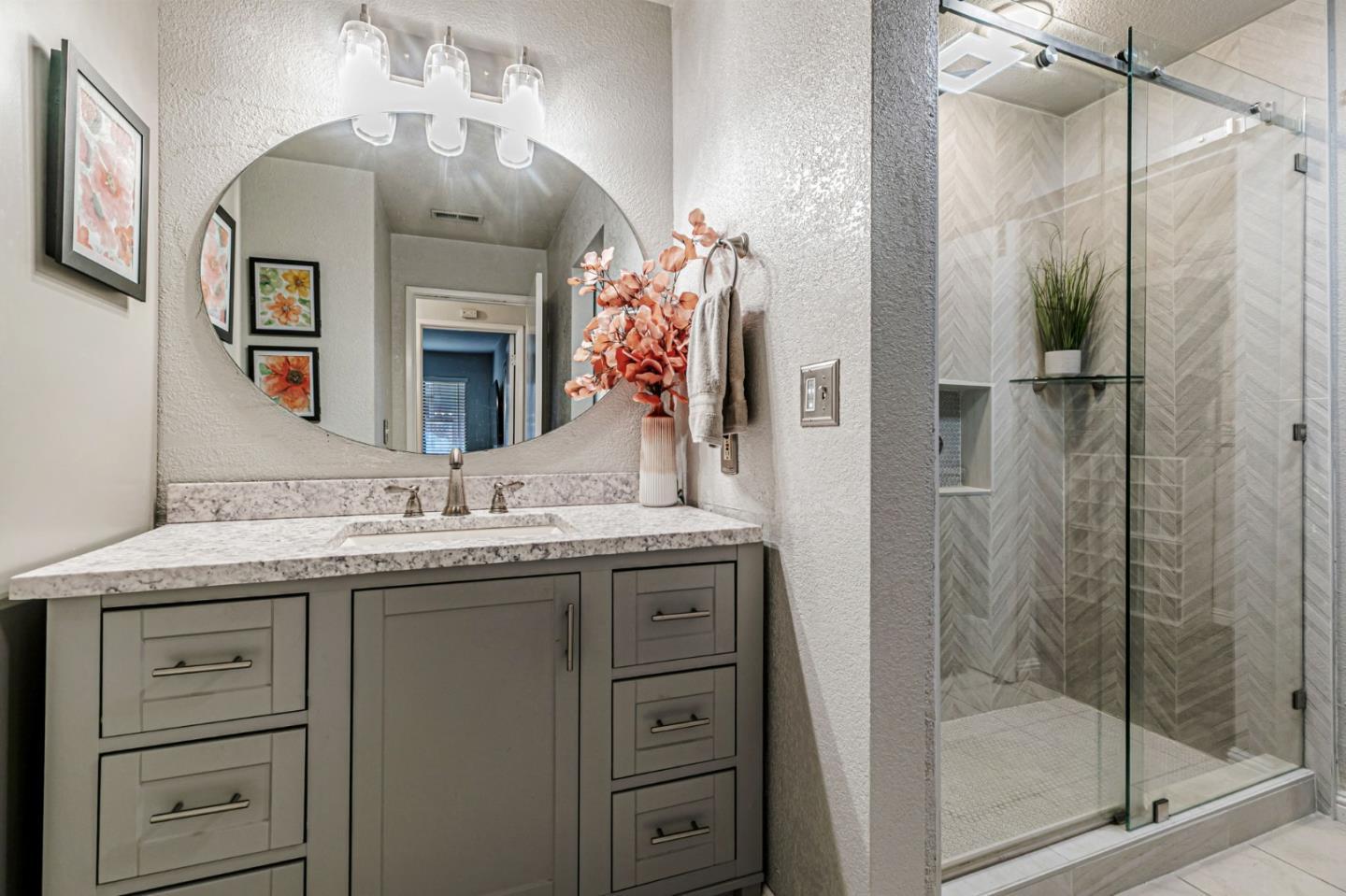3400 La Terrace Circle San Jose, CA 95123 - Photo 17 of 39 a bathroom with a granite countertop sink a mirror and a shower