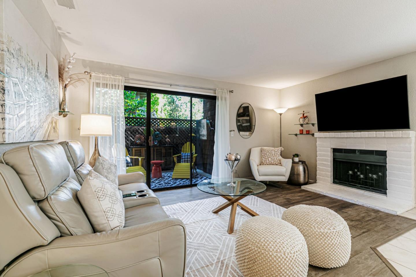 3400 La Terrace Circle San Jose, CA 95123 - Photo 5 of 39 a living room with furniture a fireplace and a flat screen tv