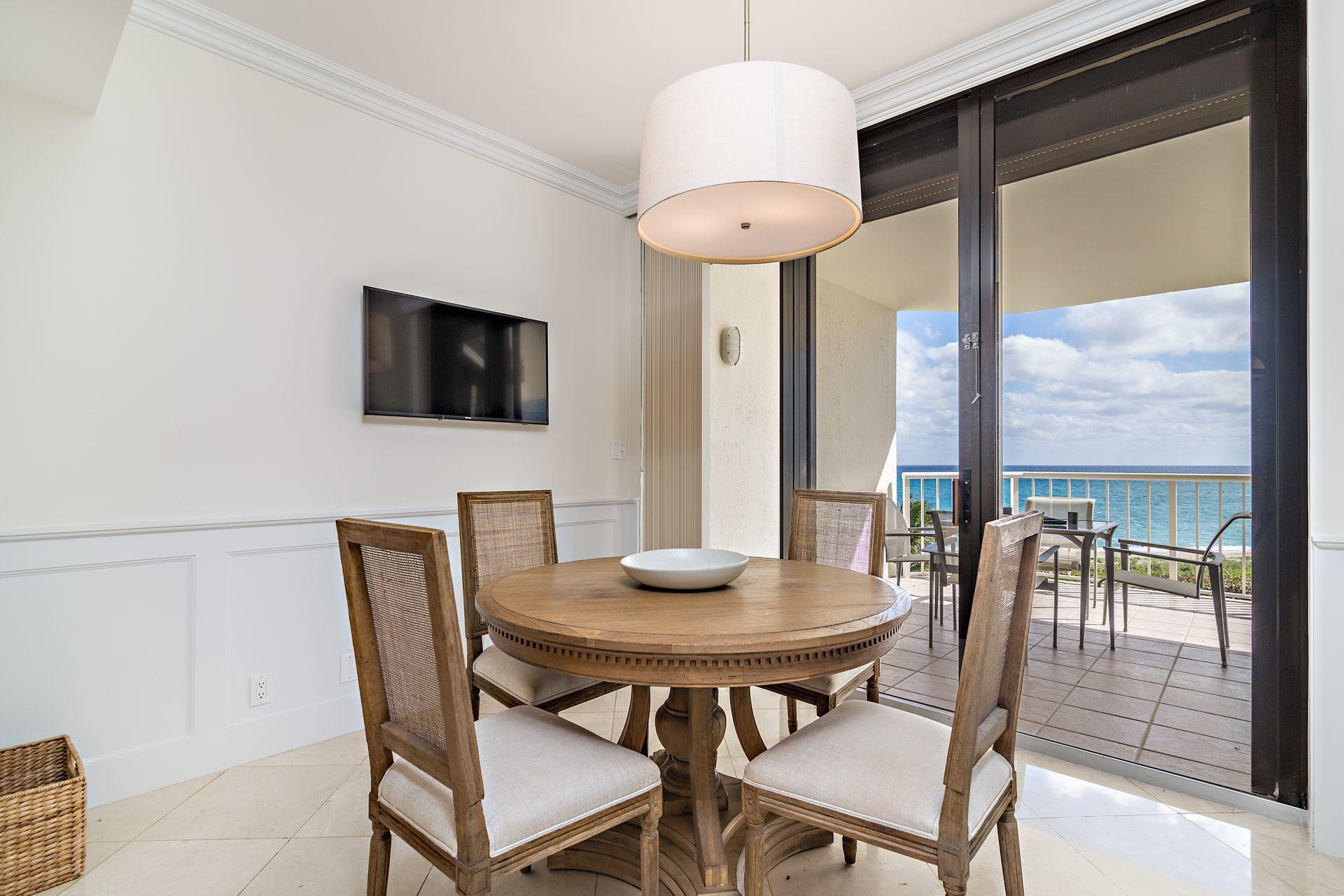 2770 South Ocean Boulevard, Unit 401S Palm Beach, FL 33480 - Photo 11 of 40 a view of a dining room with furniture window and outside view