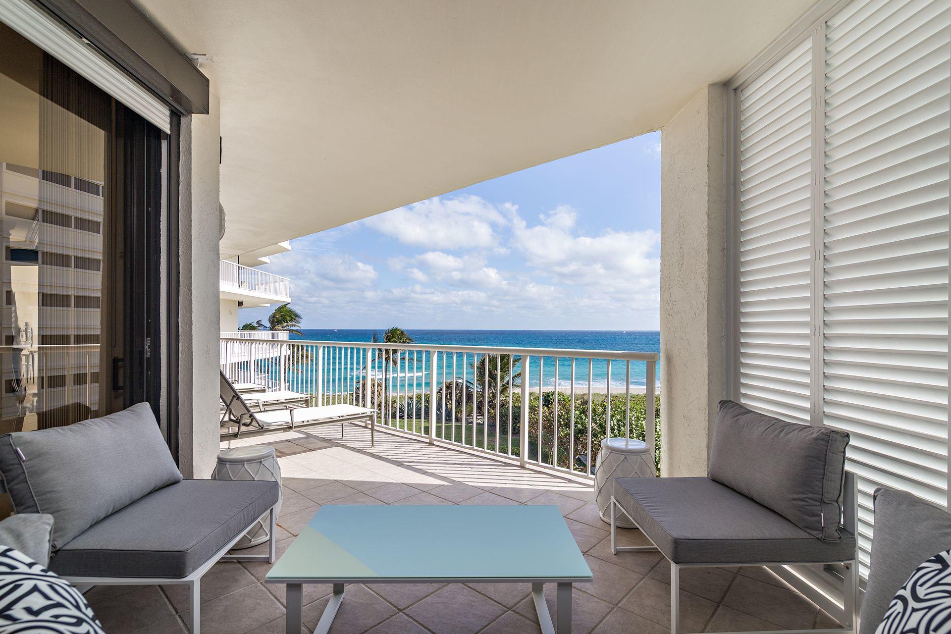 2770 South Ocean Boulevard, Unit 401S Palm Beach, FL 33480 - Photo 22 of 40 a balcony with furniture and a potted plant