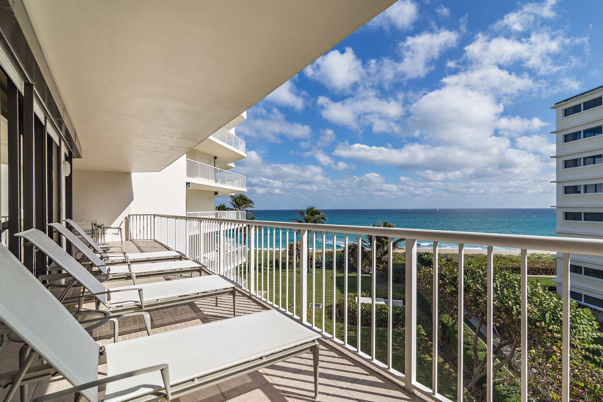 2770 South Ocean Boulevard, Unit 401S Palm Beach, FL 33480 - Photo 23 of 40 a view of a balcony with chairs