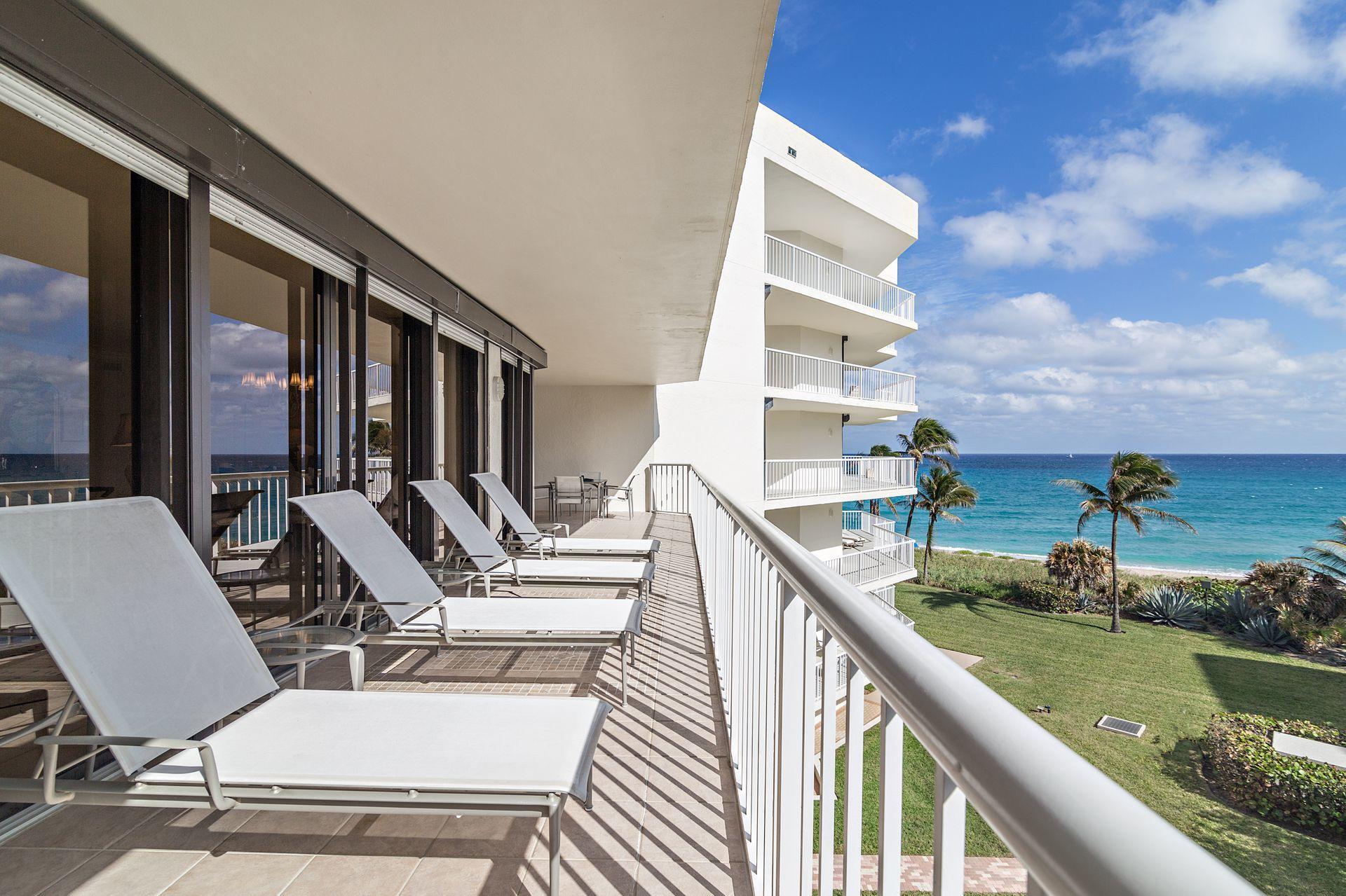 2770 South Ocean Boulevard, Unit 401S Palm Beach, FL 33480 - Photo 24 of 40 a view of swimming pool with outdoor seating and city view
