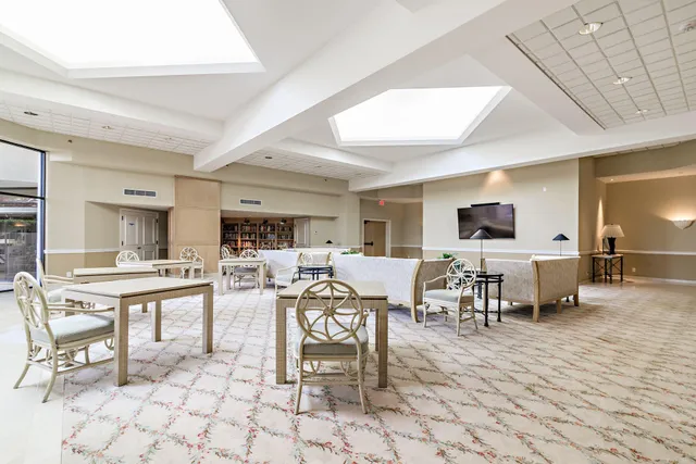 a living room with lots of furniture and a flat screen tv