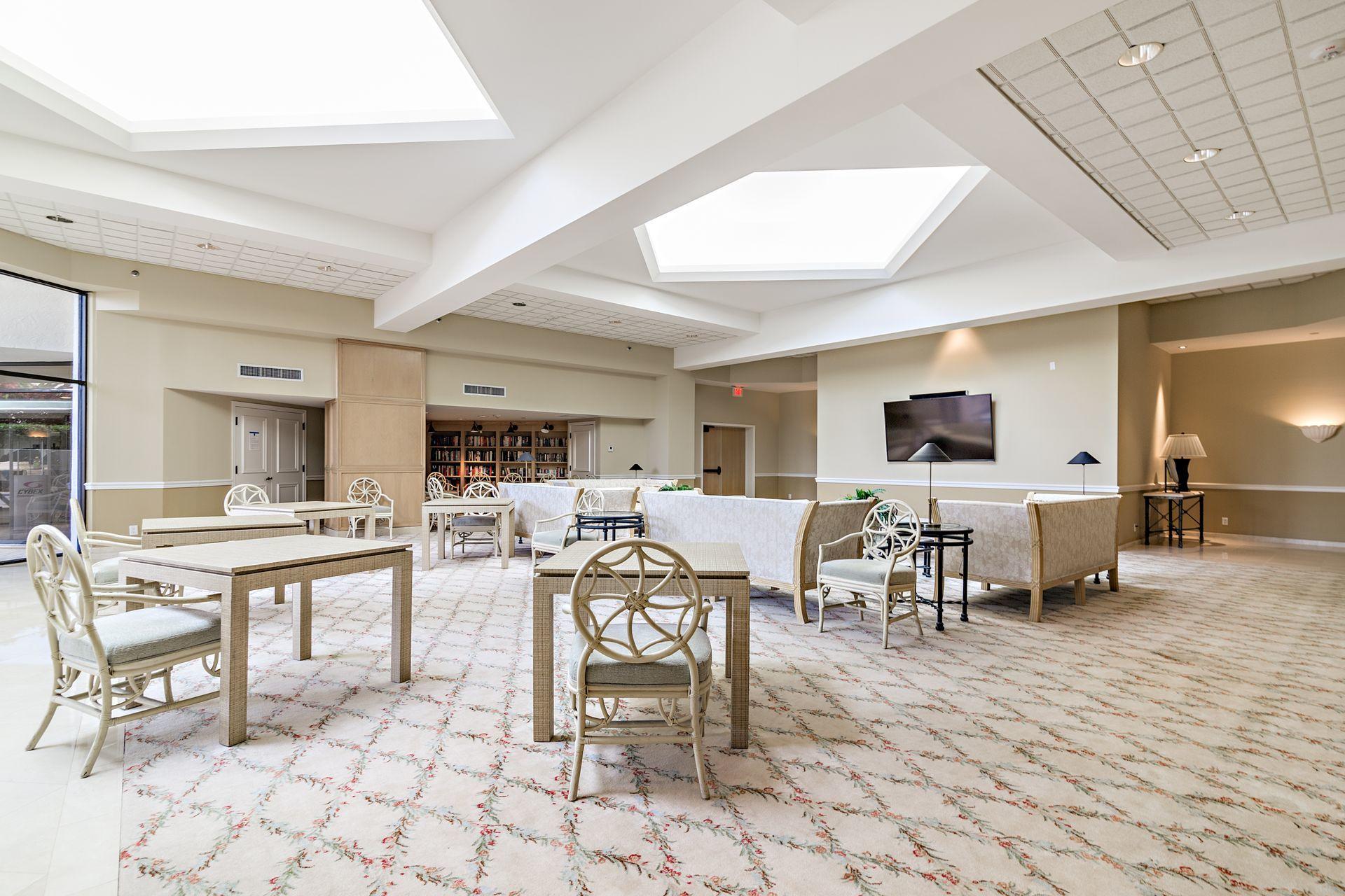 2770 South Ocean Boulevard, Unit 401S Palm Beach, FL 33480 - Photo 32 of 40 a living room with lots of furniture and a flat screen tv