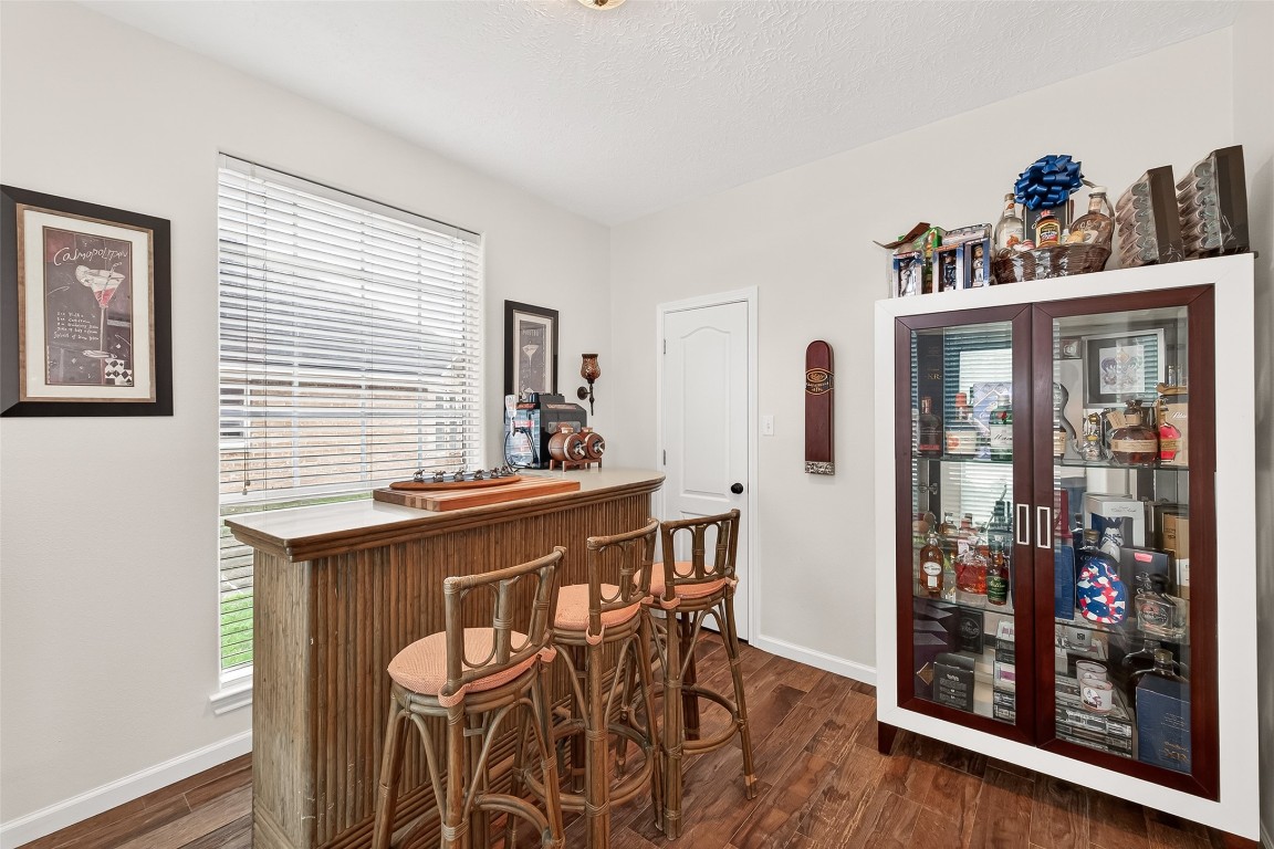 3506 Hunstanton Court Katy, TX 77450 - Photo 12 of 50 a view of a dining room with furniture and wooden floor