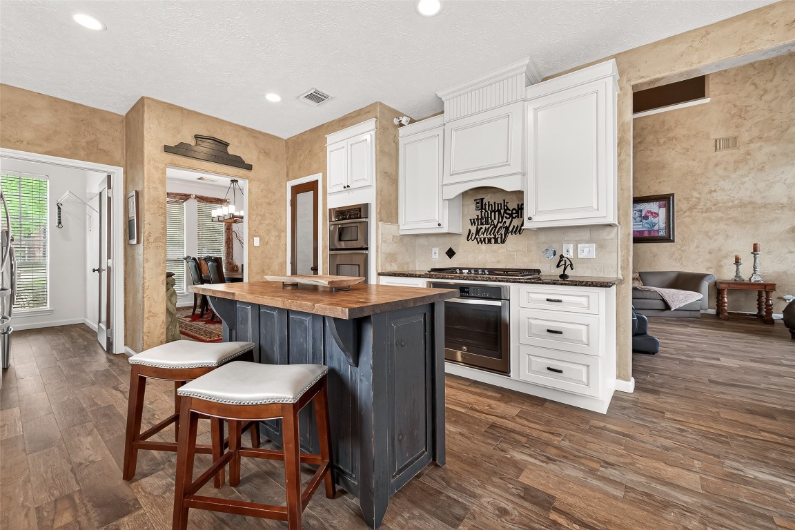 3506 Hunstanton Court Katy, TX 77450 - Photo 25 of 50 a kitchen with a table chairs and a refrigerator