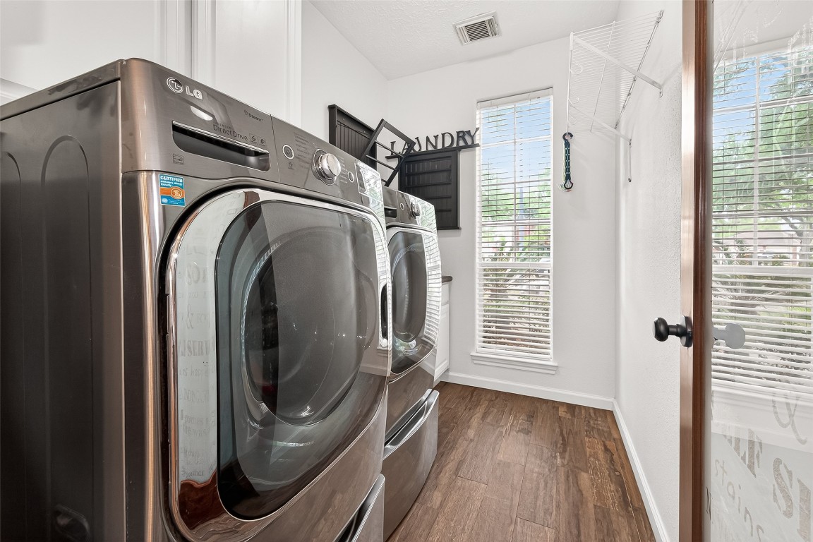 3506 Hunstanton Court Katy, TX 77450 - Photo 27 of 50 a view of a storage and utility room with washer and dryer