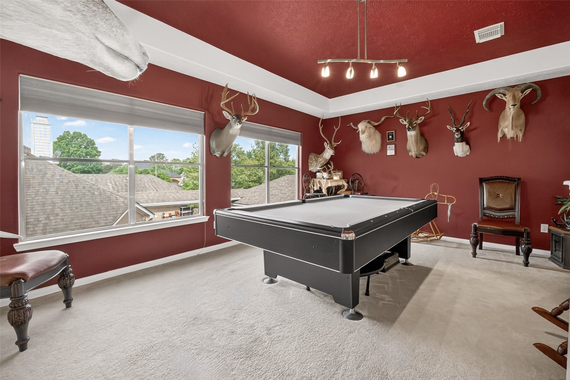 3506 Hunstanton Court Katy, TX 77450 - Photo 36 of 50 a living room with furniture pool table and a large window