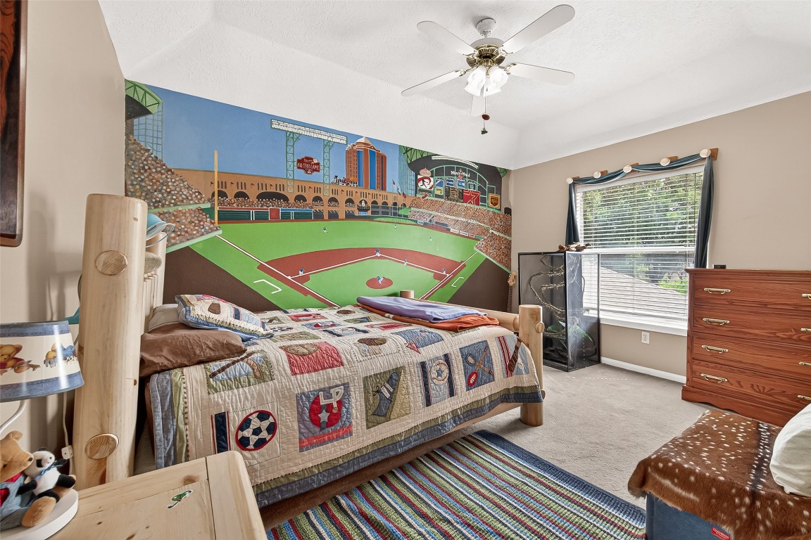 3506 Hunstanton Court Katy, TX 77450 - Photo 42 of 50 a bedroom with a bed and a baby crib with the dresser