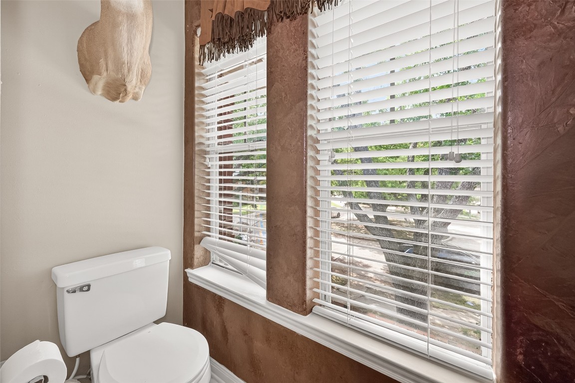 3506 Hunstanton Court Katy, TX 77450 - Photo 45 of 50 a white toilet sitting next to a window
