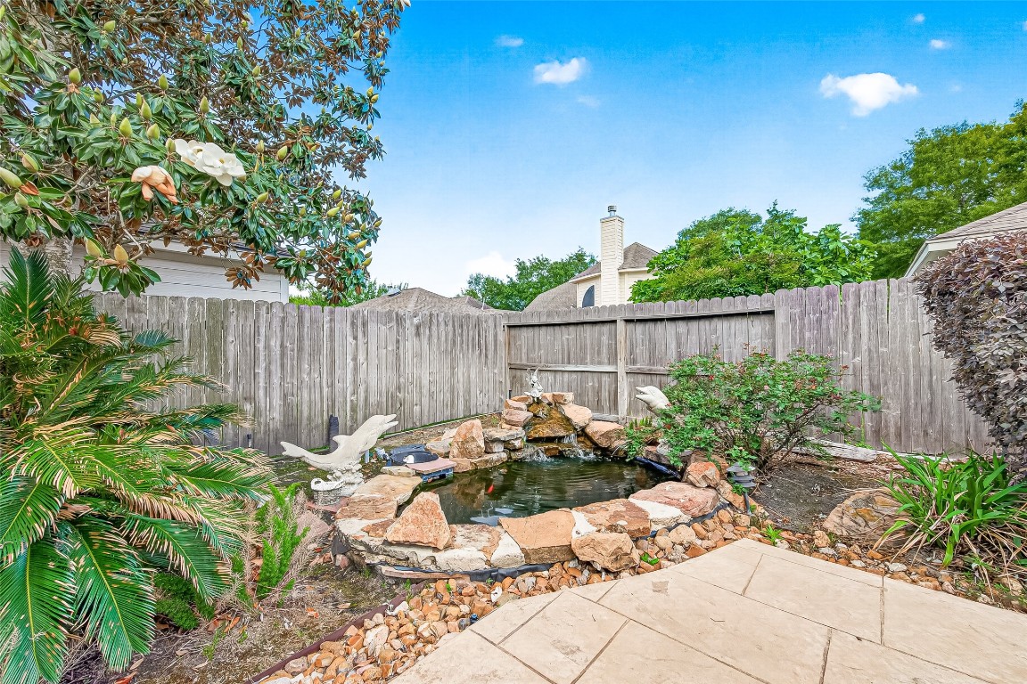 3506 Hunstanton Court Katy, TX 77450 - Photo 49 of 50 a view of a backyard with plants and tree