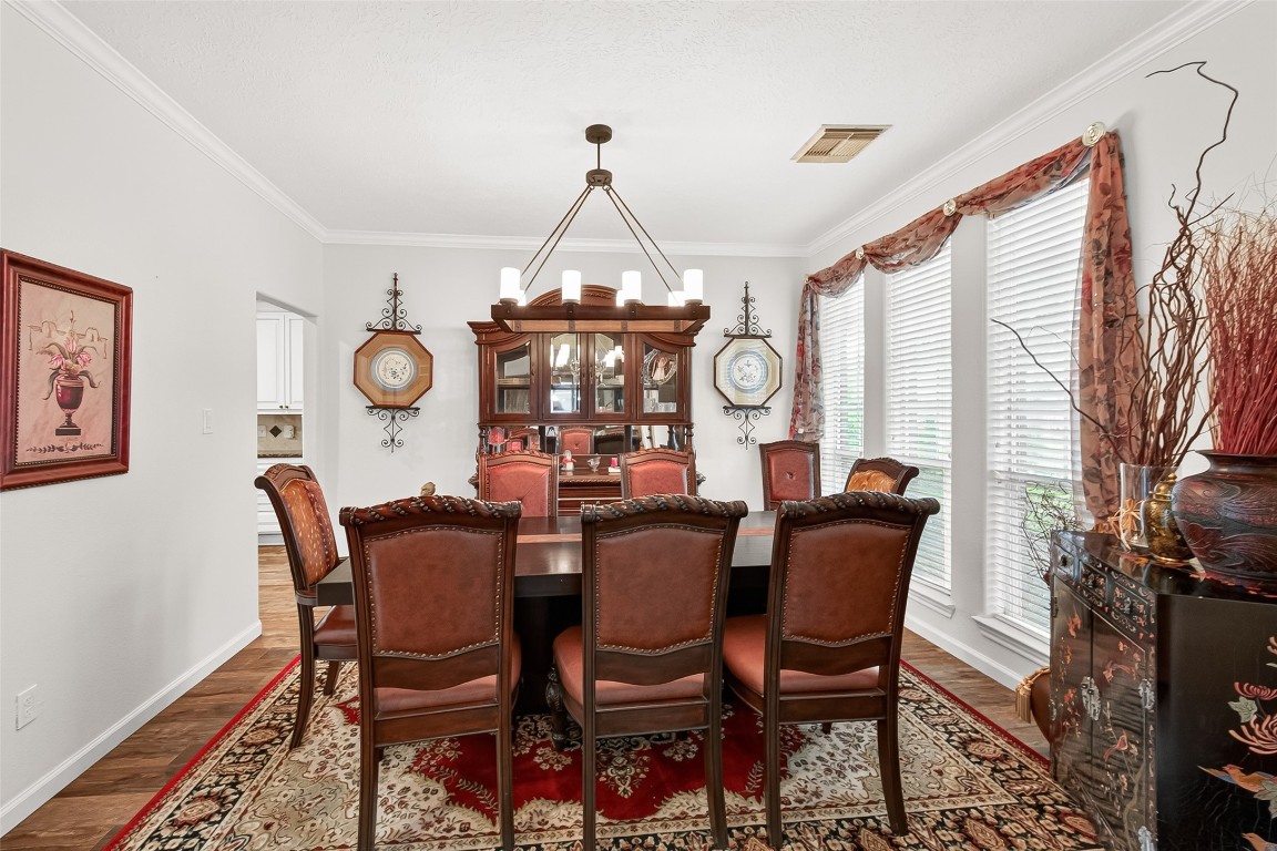 3506 Hunstanton Court Katy, TX 77450 - Photo 9 of 50 a view of a dining room with furniture and a chandelier