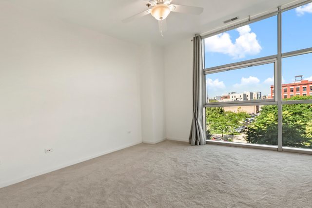 225 South Sangamon Street, Unit 412 Chicago, IL 60607 - Photo 14 of 29 an empty room with a window