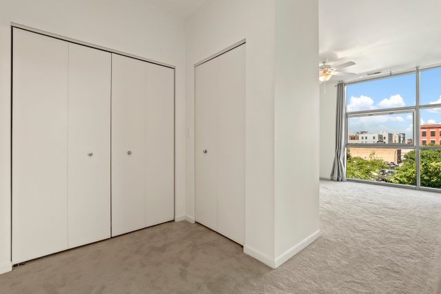 225 South Sangamon Street, Unit 412 Chicago, IL 60607 - Photo 15 of 29 wooden floor in an empty room with a window