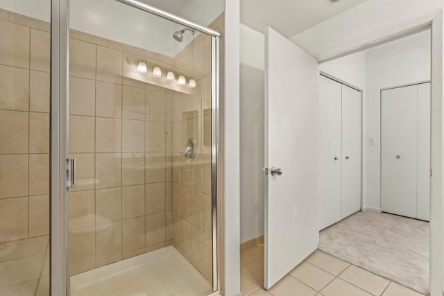 225 South Sangamon Street, Unit 412 Chicago, IL 60607 - Photo 18 of 29 a bathroom that has a glass shower door
