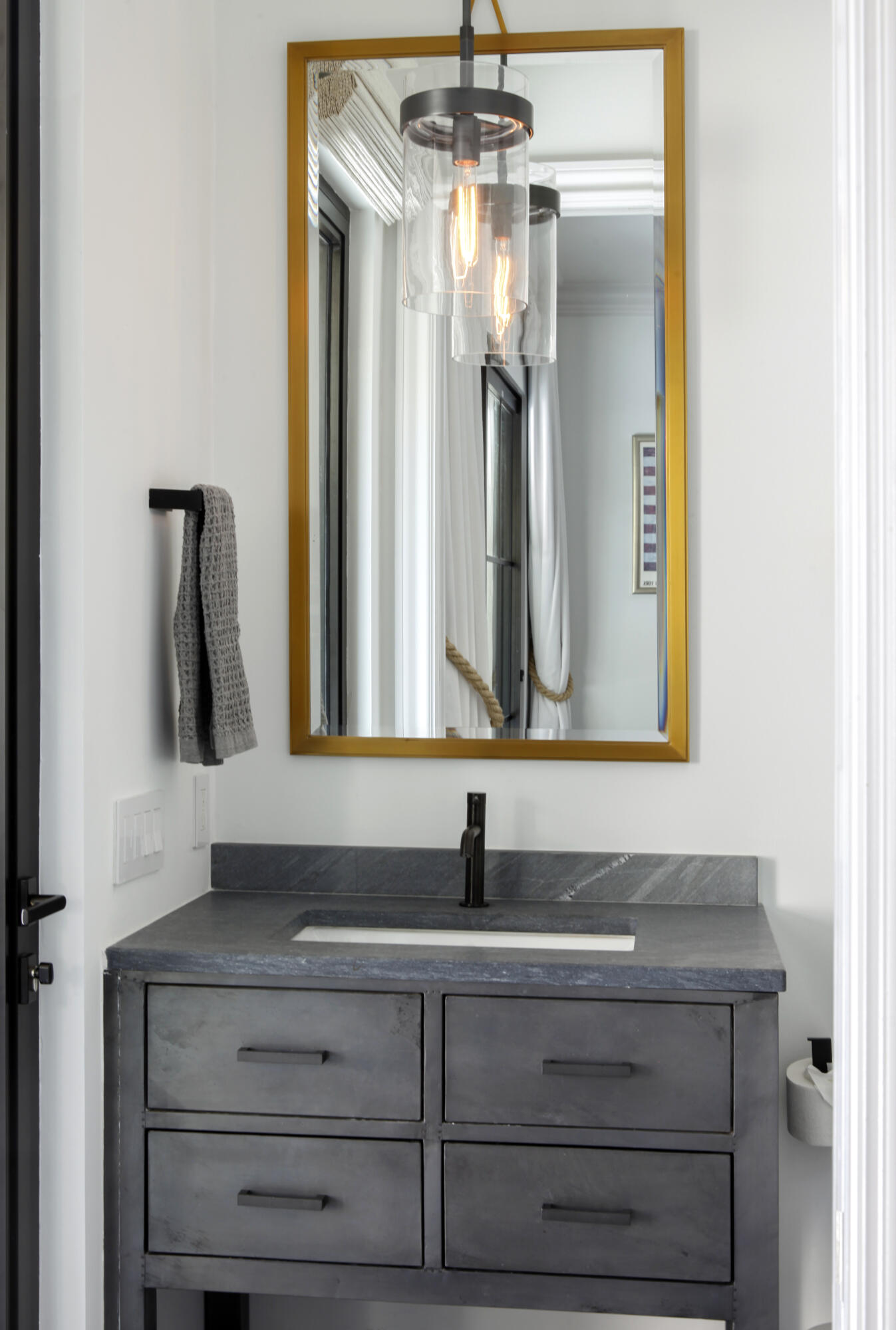 2555 Northwest 59th Street Boca Raton, FL 33496 - Photo 13 of 33 a bathroom with a sink and a mirror