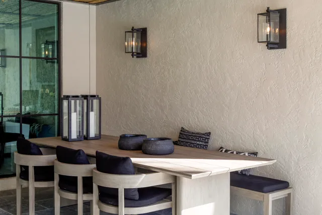 a view of a house with backyard patio and swimming pool