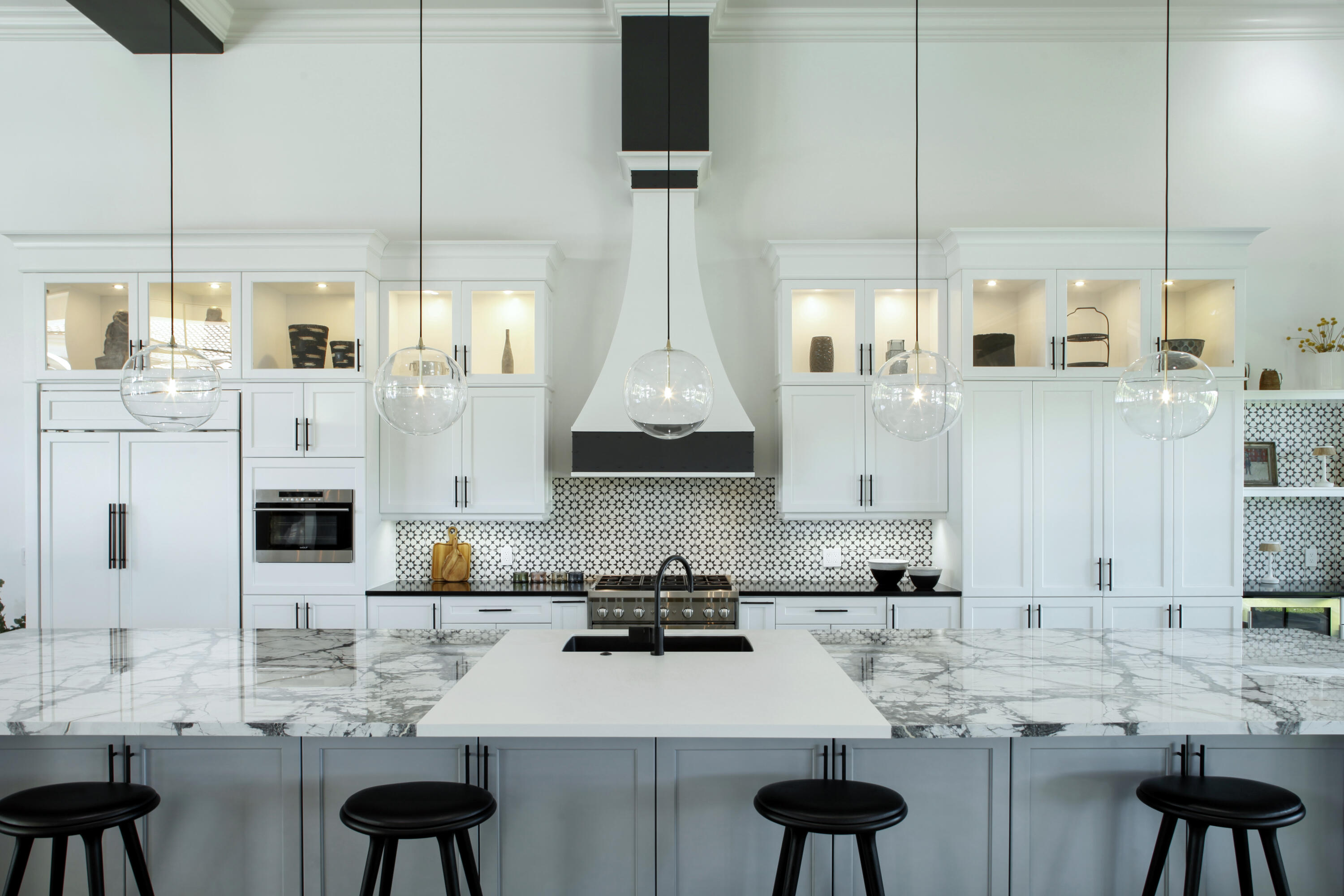 2555 Northwest 59th Street Boca Raton, FL 33496 - Photo 2 of 33 a kitchen with stainless steel appliances kitchen island granite countertop a stove a sink and a white wooden cabinets