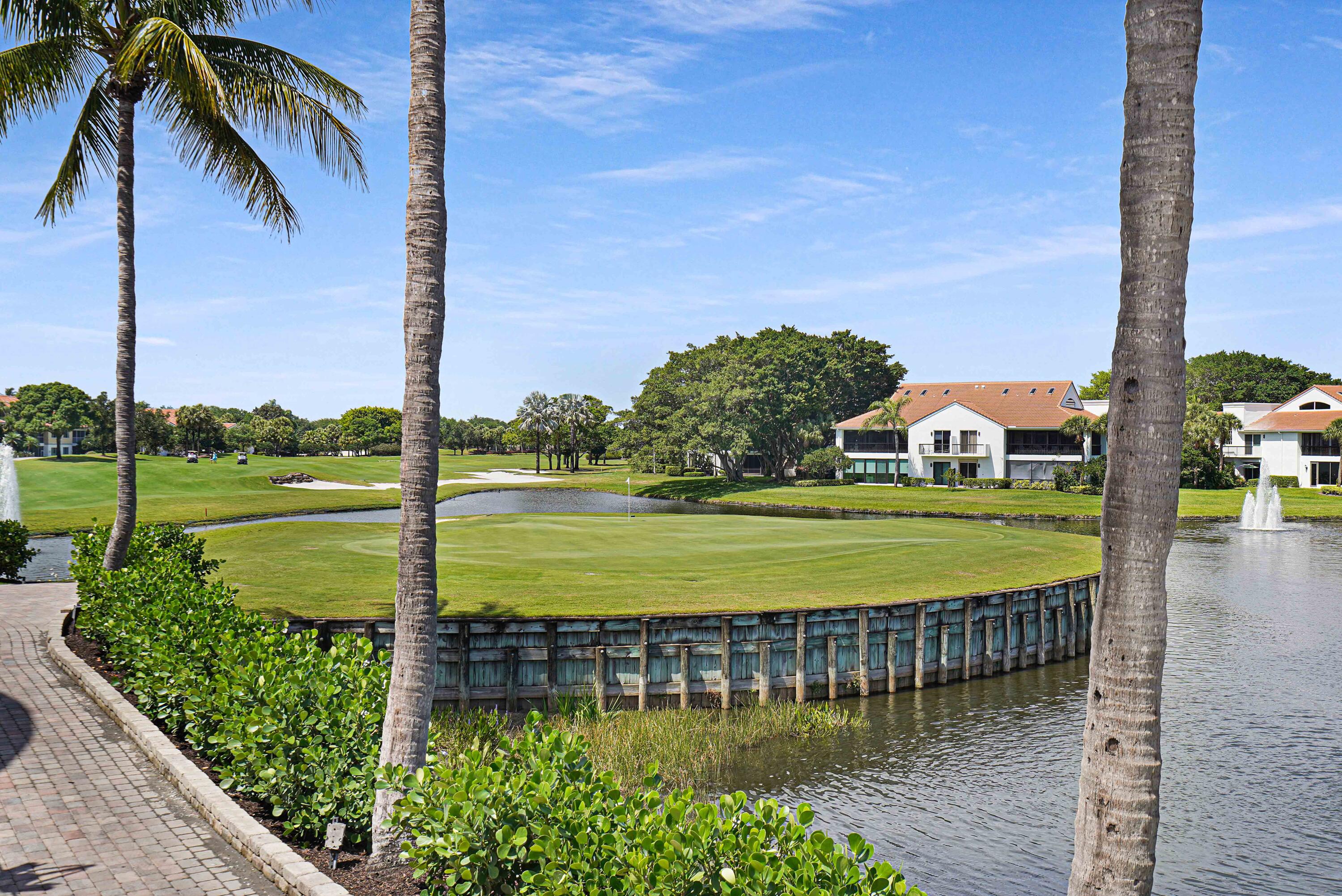 2555 Northwest 59th Street Boca Raton, FL 33496 - Photo 24 of 33 a view of a lake with a big yard