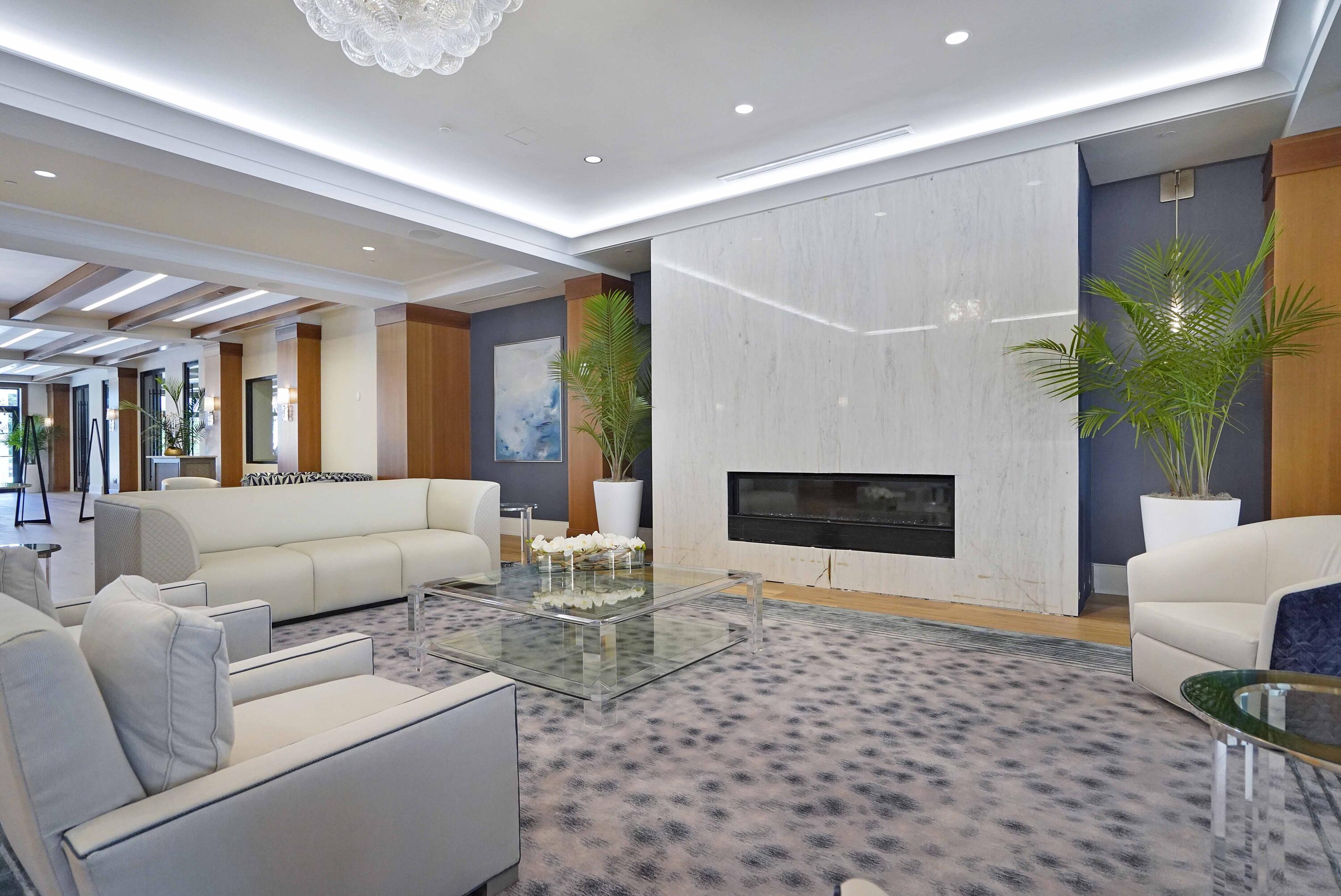 2555 Northwest 59th Street Boca Raton, FL 33496 - Photo 27 of 33 a living room with furniture a fireplace and a potted plant