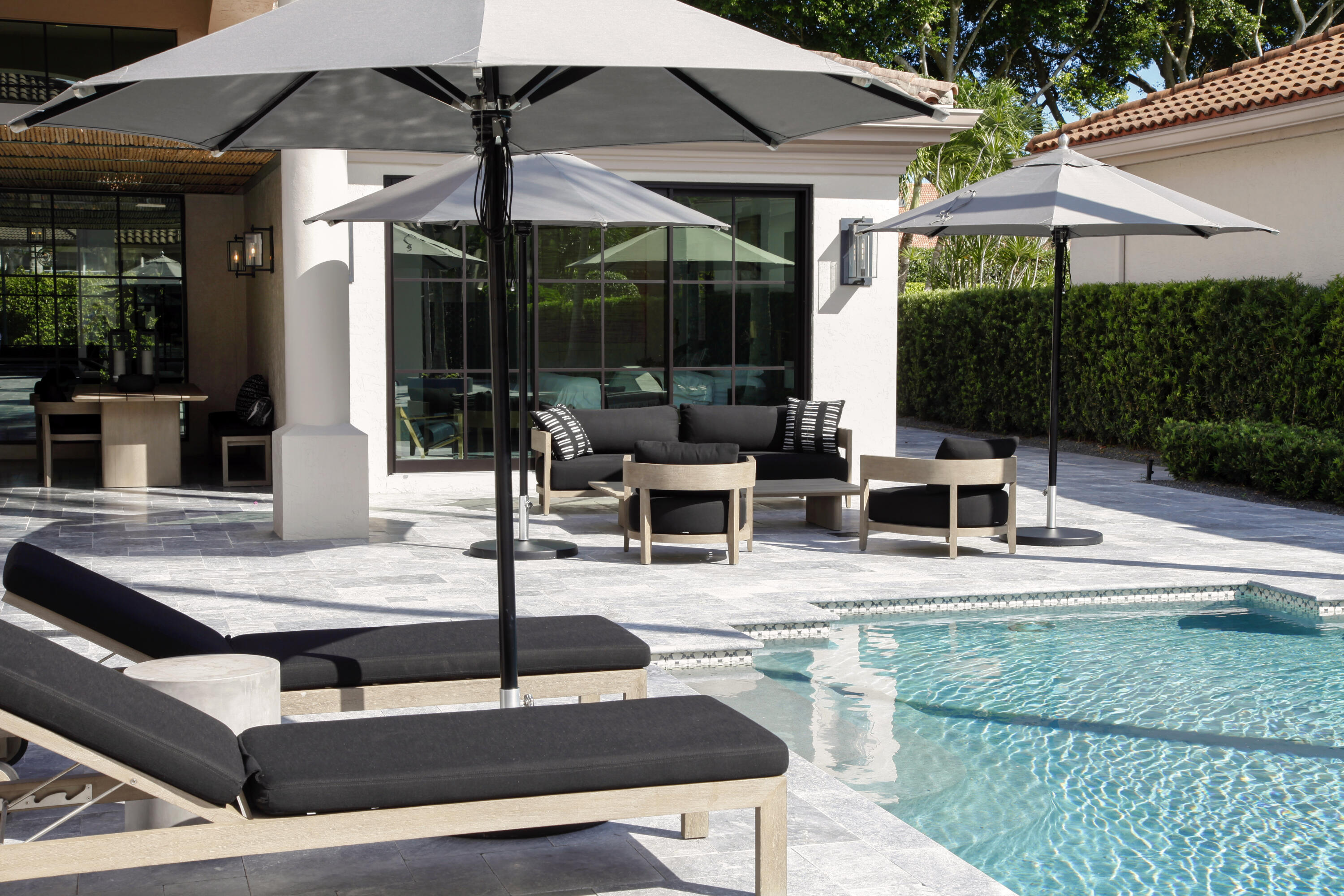 2555 Northwest 59th Street Boca Raton, FL 33496 - Photo 3 of 33 a view of patio with chairs and table under an umbrella