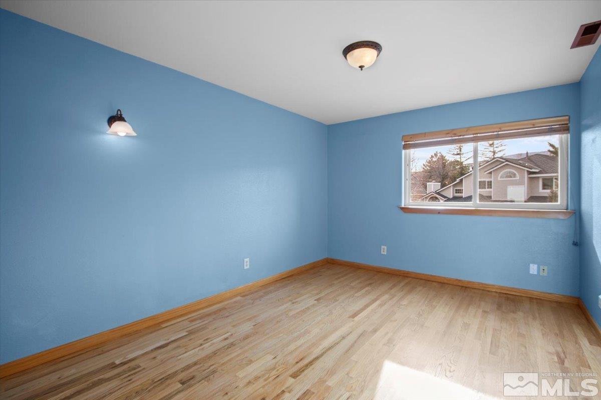 2616 Starr Meadows Loop Reno, NV 89519 - Photo 26 of 39 a view of empty room with wooden floor