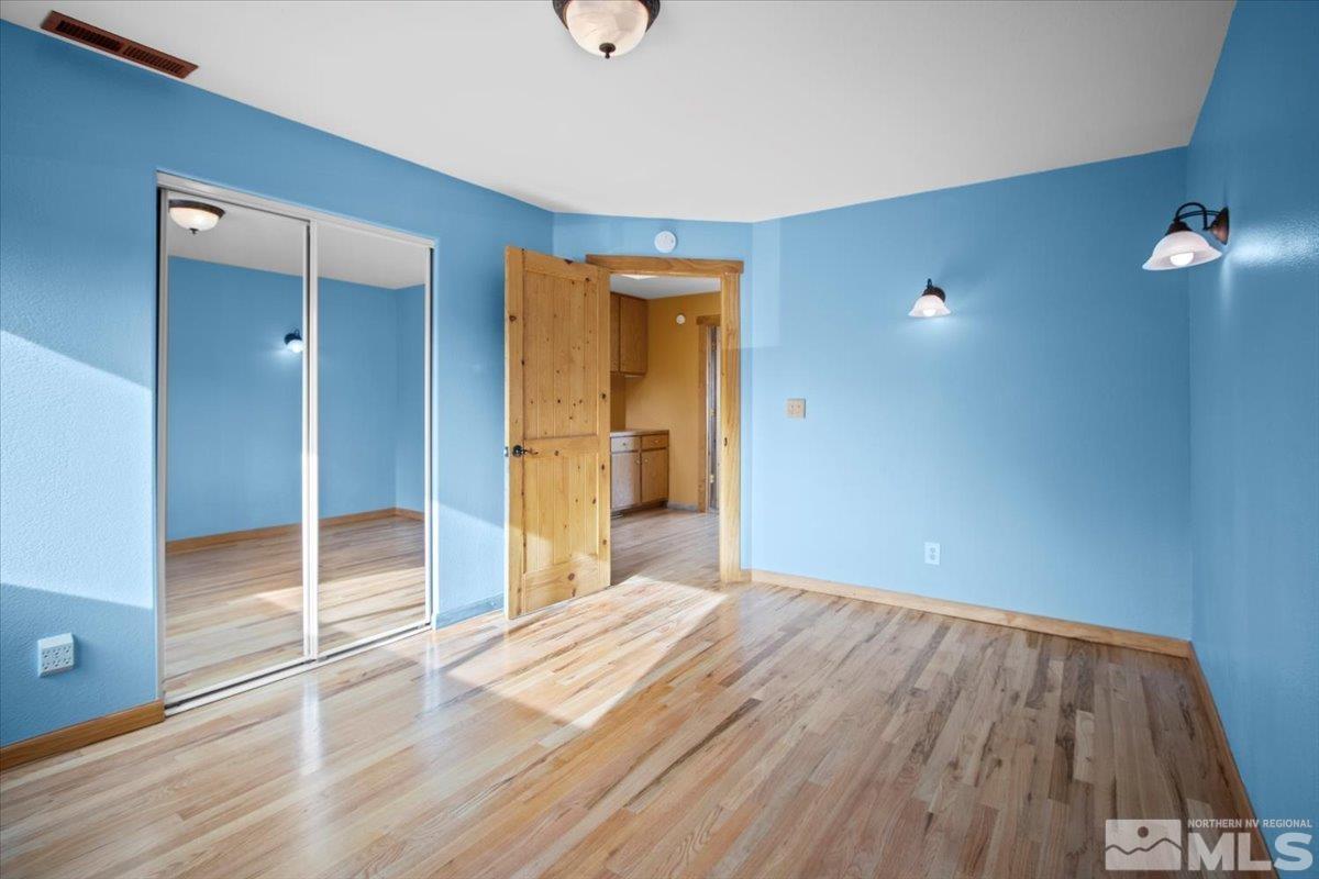 2616 Starr Meadows Loop Reno, NV 89519 - Photo 27 of 39 a view of a livingroom with wooden floor and a bathroom