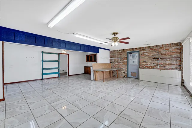 a view of a livingroom with furniture and white walls