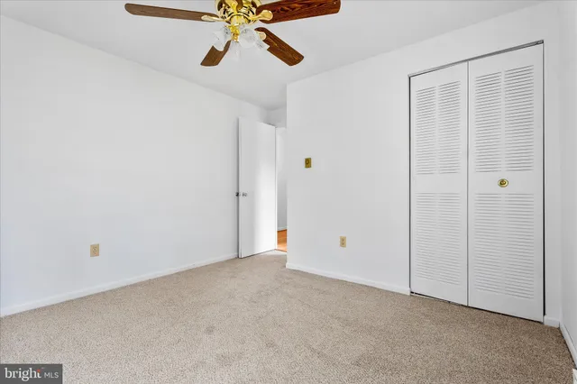 a view of a hall with wooden floor