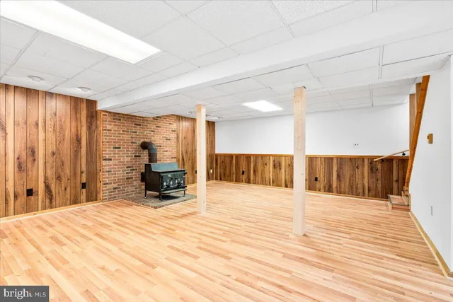 a view of a room with a wooden floor