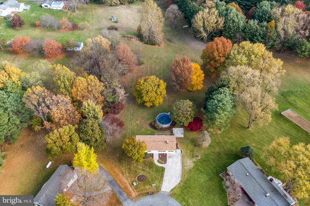 a view of a backyard with swimming pool