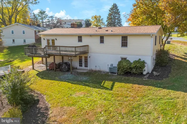 a picture of a bench in front of a wall