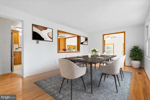a view of a livingroom with a dining table and chair