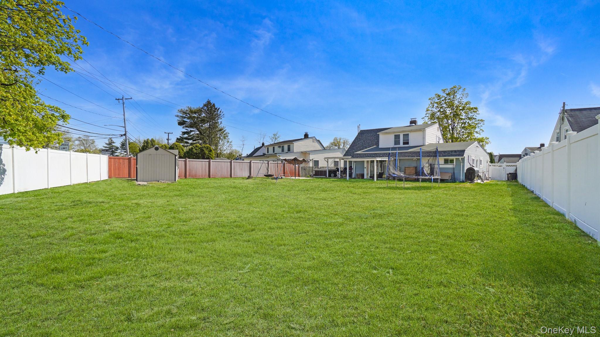 63 Blacksmith Road Levittown, NY 11756 - Photo 6 of 25 Expansive green lawn providing ample outdoor space